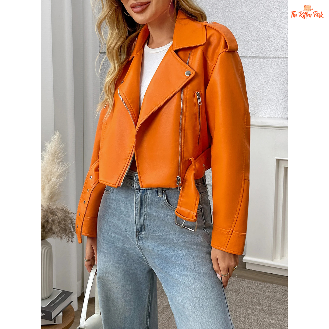 A women’s orange PU leather motorcycle jacket with lapel collar, zip closure, and casual biker style.