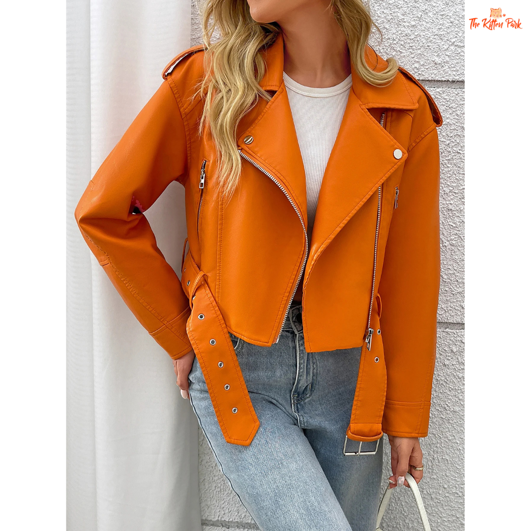 A women’s orange PU leather motorcycle jacket with lapel collar, zip closure, and casual biker style.