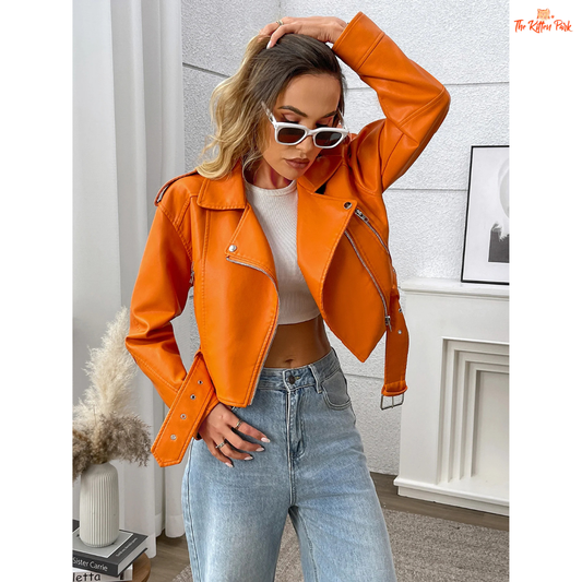 A women’s orange PU leather motorcycle jacket with lapel collar, zip closure, and casual biker style.
