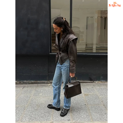 Light brown faux leather overcoat for women with belted high waist, turn-down collar, full sleeves and zipper closure — vintage high-street style for autumn/winter.