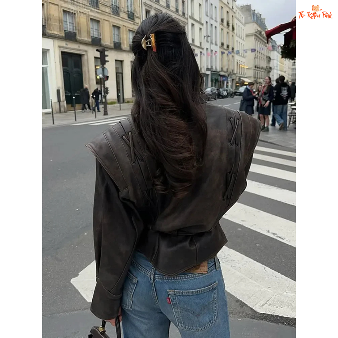 Light brown faux leather overcoat for women with belted high waist, turn-down collar, full sleeves and zipper closure — vintage high-street style for autumn/winter.