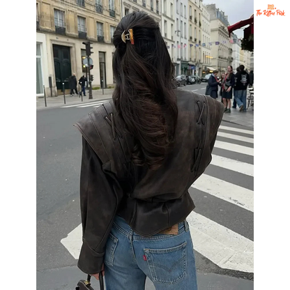 Light brown faux leather overcoat for women with belted high waist, turn-down collar, full sleeves and zipper closure — vintage high-street style for autumn/winter.