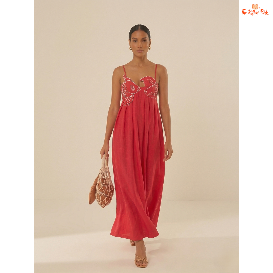 Red backless maxi dress with asymmetrical neckline, spaghetti straps, floral detail, and slim A-line summer party style.
