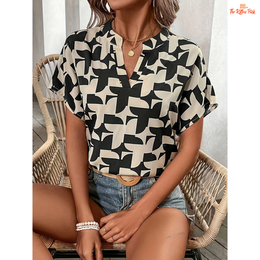 V-neck summer blouse for women with elegant print, batwing sleeves, and regular fit — ideal for office or casual wear.
