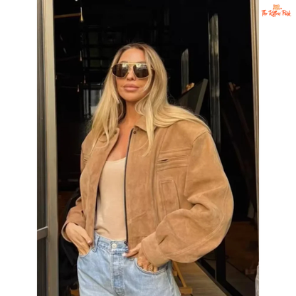 A women's camel suede cropped jacket with turn-down lapel collar, zipper closure, and pockets, designed for chic streetwear in autumn and winter.

