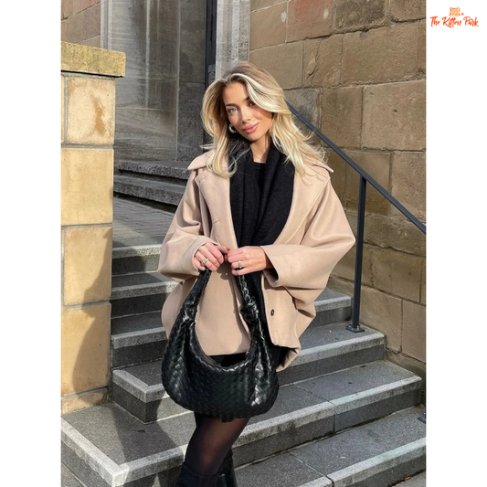 A women’s solid color lapel jacket in beige with single-breasted closure, loose fit, and casual long-sleeve design for autumn and winter wear.