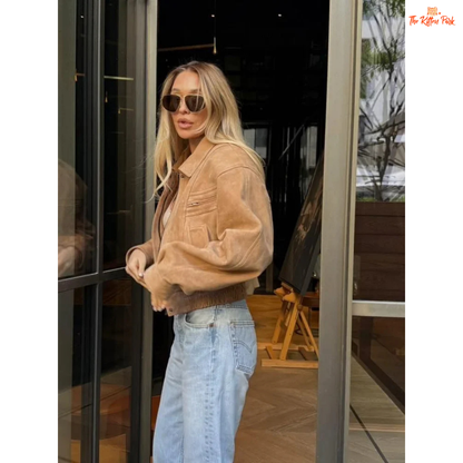 A women's camel suede cropped jacket with turn-down lapel collar, zipper closure, and pockets, designed for chic streetwear in autumn and winter.

