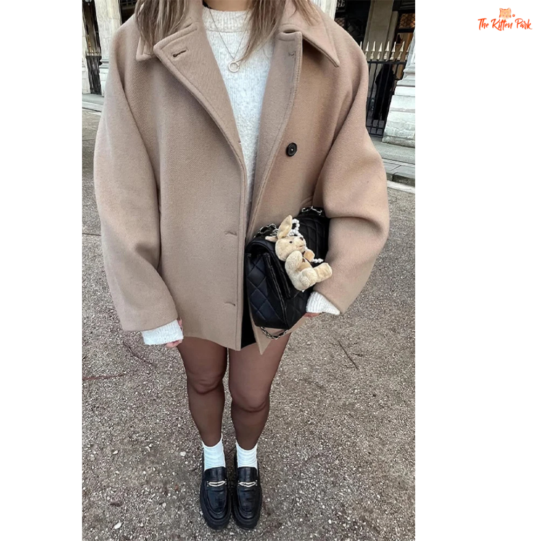 A women’s solid color lapel jacket in beige with single-breasted closure, loose fit, and casual long-sleeve design for autumn and winter wear.