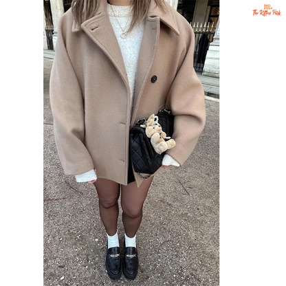 A women’s solid color lapel jacket in beige with single-breasted closure, loose fit, and casual long-sleeve design for autumn and winter wear.