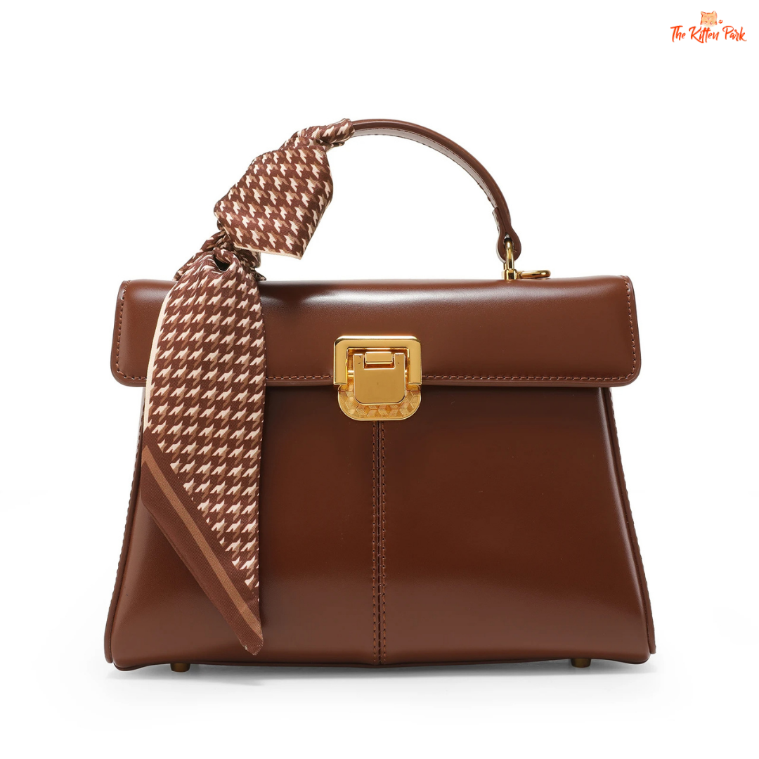 Soft split leather women’s square crossbody bag featuring elegant scarf decor, hasp closure, and fashion-forward minimalist design.