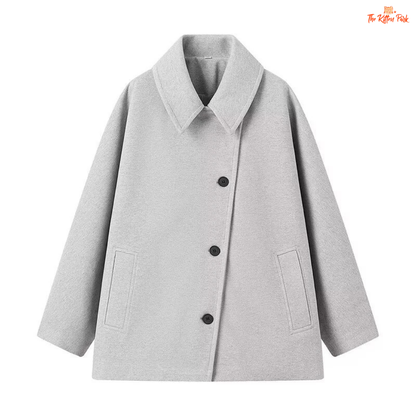 A women’s solid color lapel jacket in beige with single-breasted closure, loose fit, and casual long-sleeve design for autumn and winter wear.