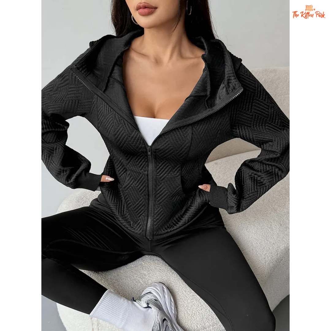A modern women’s zip-up streetwear top featuring a hood, wool-lined interior, and sleek sporty design