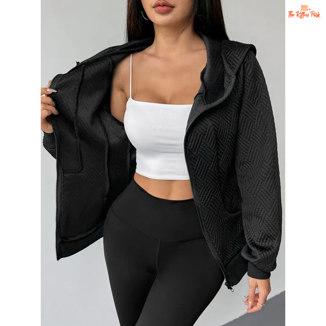 A modern women’s zip-up streetwear top featuring a hood, wool-lined interior, and sleek sporty design