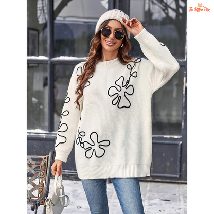 Soft beige round-neck pullover sweater for women featuring floral prints, knit texture, and a loose long fit perfect for casual autumn and winter wear.