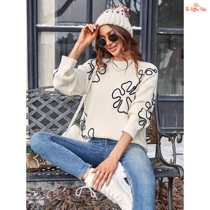 Soft beige round-neck pullover sweater for women featuring floral prints, knit texture, and a loose long fit perfect for casual autumn and winter wear.