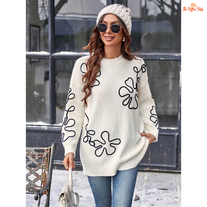 Soft beige round-neck pullover sweater for women featuring floral prints, knit texture, and a loose long fit perfect for casual autumn and winter wear.