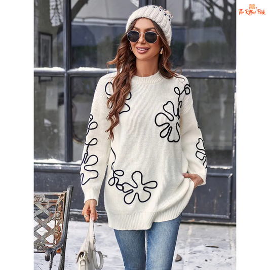 Soft beige round-neck pullover sweater for women featuring floral prints, knit texture, and a loose long fit perfect for casual autumn and winter wear.