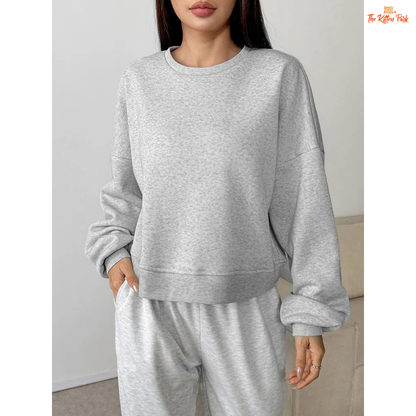 A slim-fit women’s pullover hoodie featuring an O-neck design, wool-lined interior, and soft knit texture