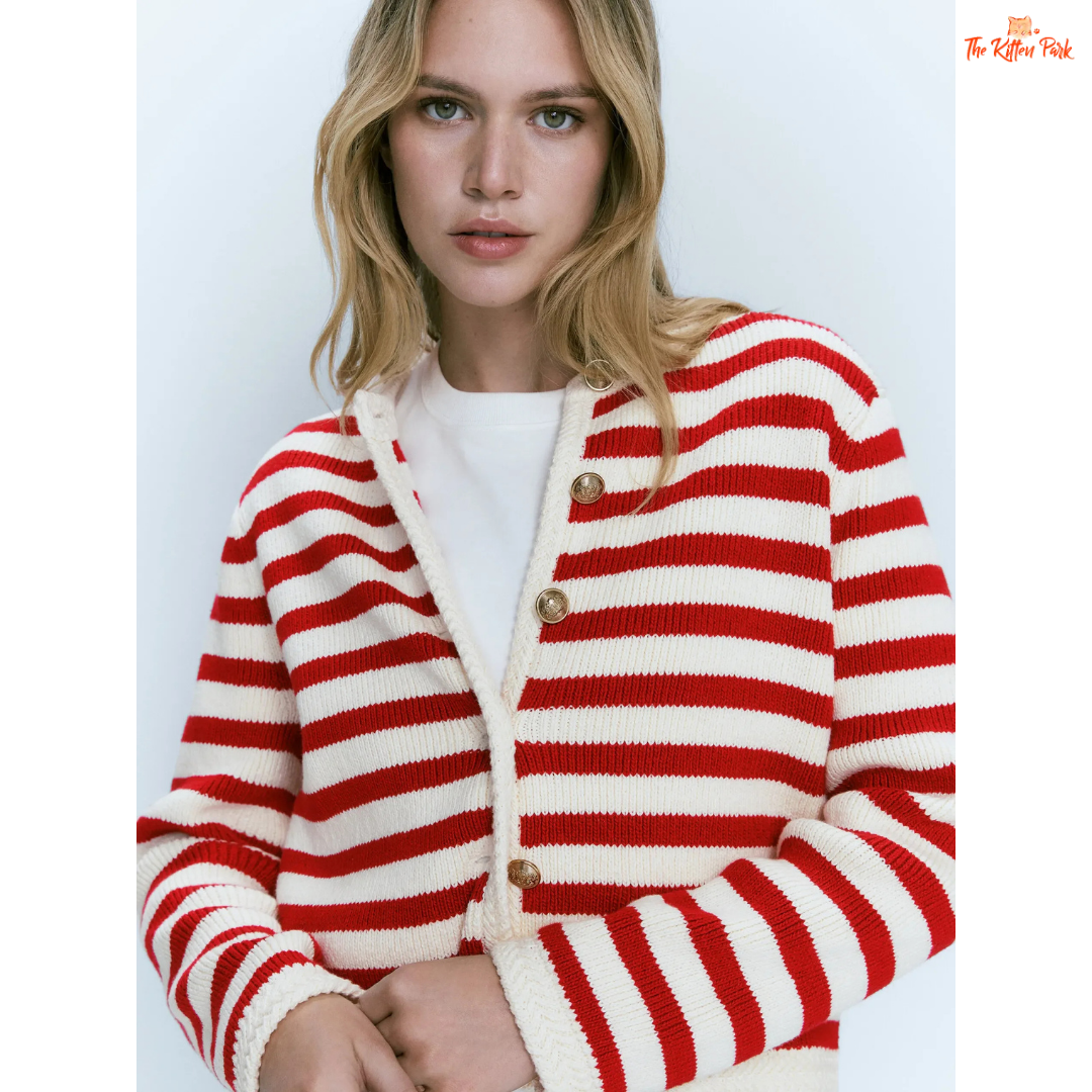 Woman wearing a red and white striped cardigan on a white background