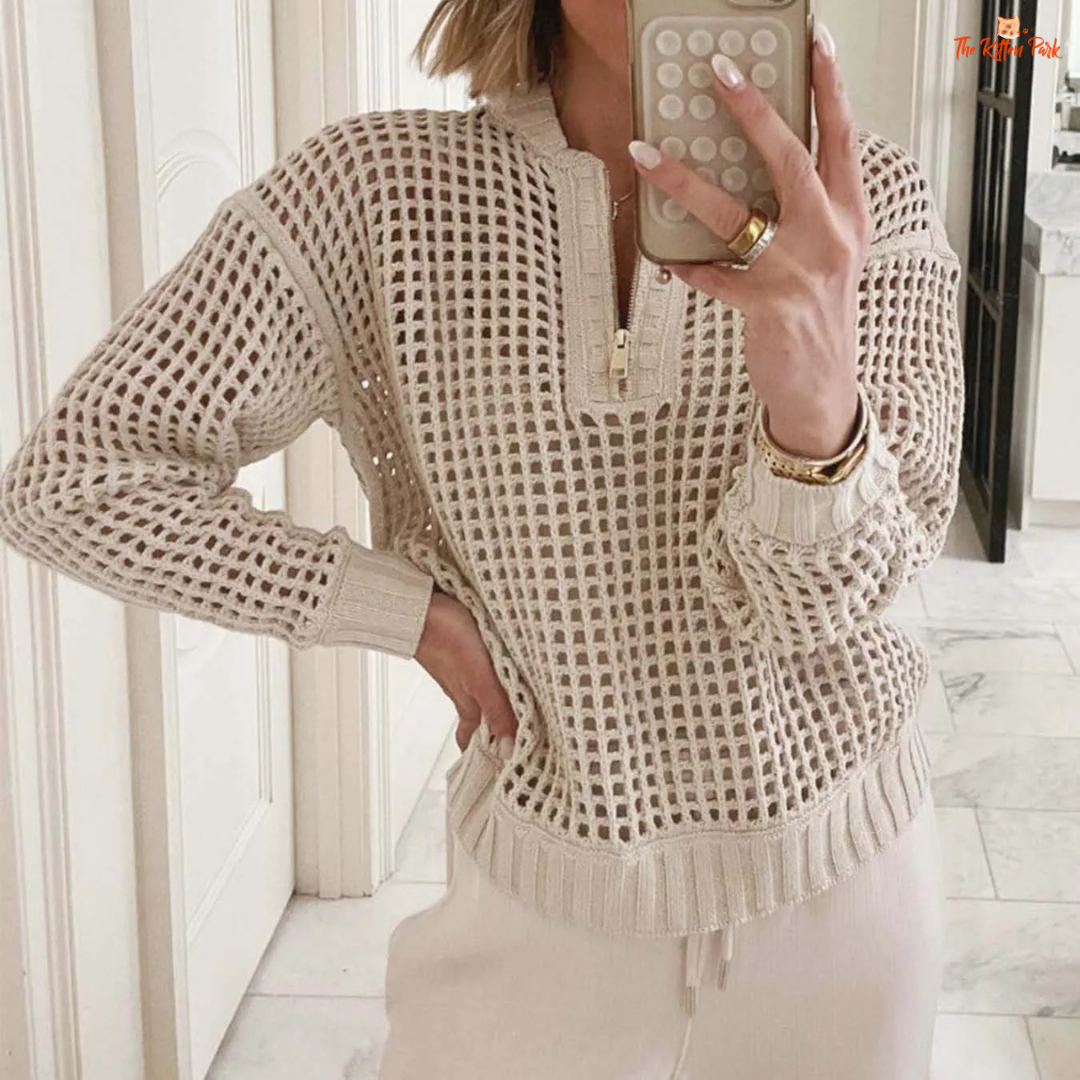 Beige V-neck hollow-out knit sweater with zipper front, loose fit and stylish streetwear design for women.