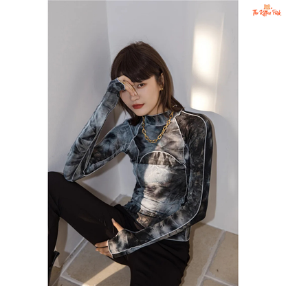 Grey tie-dye turtleneck with a slim fit and gradient pattern, ideal for fall fashion with a body-hugging silhouette and full sleeves.