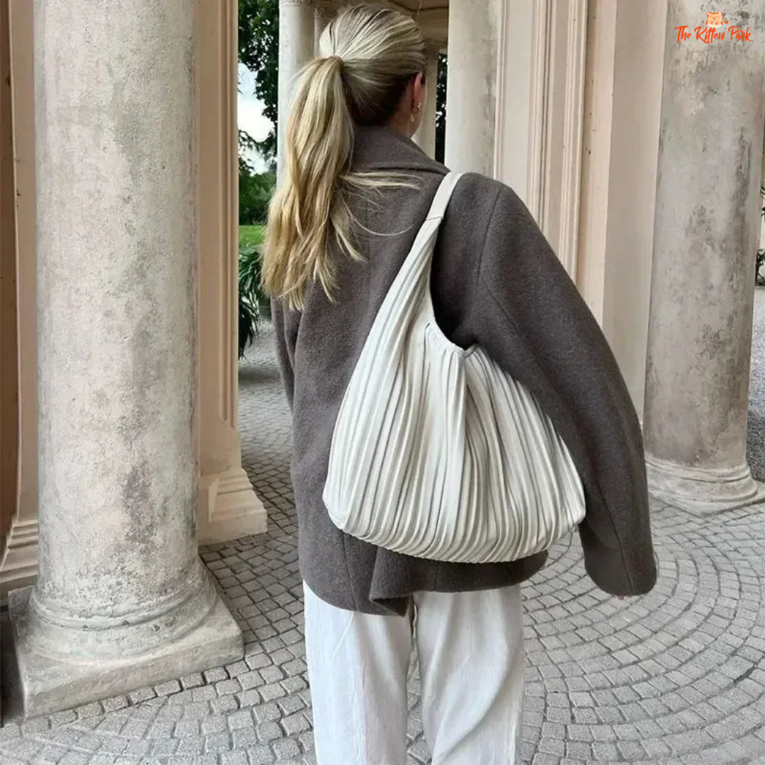 A women’s camel brown double-breasted wool coat with lapel collar, long sleeves, and a loose fit, designed for autumn and winter elegance.