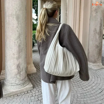 A women’s camel brown double-breasted wool coat with lapel collar, long sleeves, and a loose fit, designed for autumn and winter elegance.