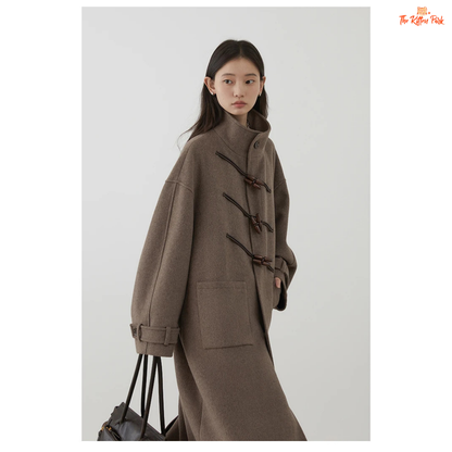 Women's long camel wool-blend overcoat with single-breasted front, stand collar, drop-shoulder sleeves, wide-waisted fit, and button details for autumn/winter.