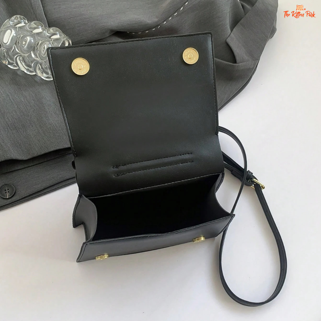 Black collar-shaped women's crossbody bag with a flip cover and bucket-style design, made from PU material for a playful, modern accessory look.