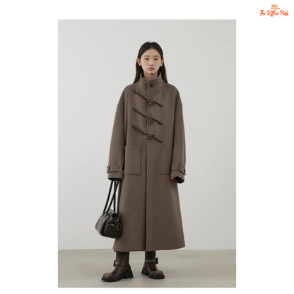Women's long camel wool-blend overcoat with single-breasted front, stand collar, drop-shoulder sleeves, wide-waisted fit, and button details for autumn/winter.