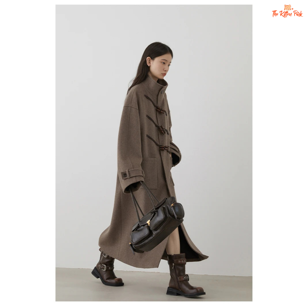 Women's long camel wool-blend overcoat with single-breasted front, stand collar, drop-shoulder sleeves, wide-waisted fit, and button details for autumn/winter.