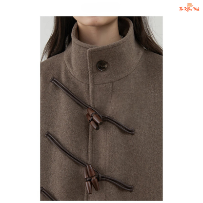 Women's long camel wool-blend overcoat with single-breasted front, stand collar, drop-shoulder sleeves, wide-waisted fit, and button details for autumn/winter.