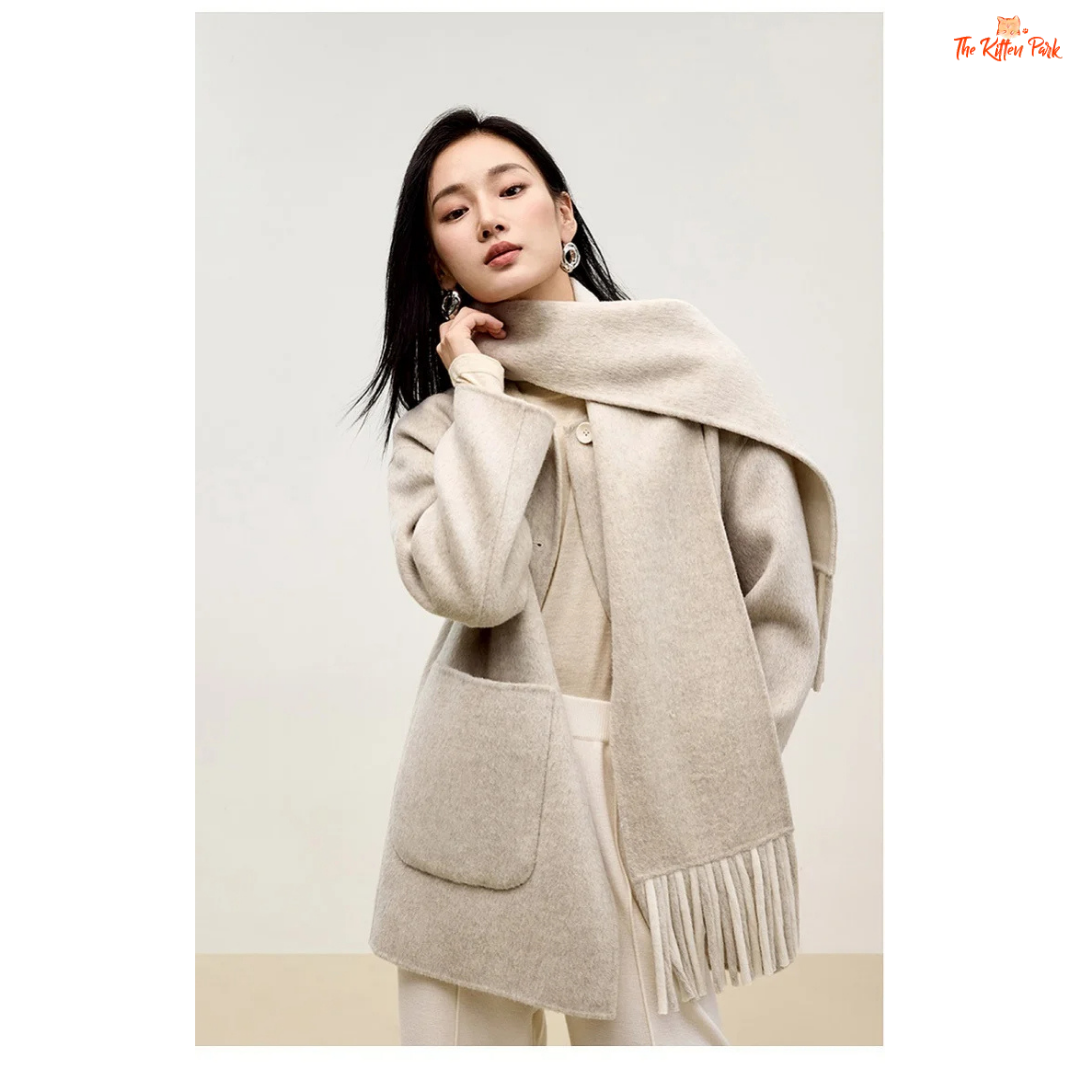 Women’s 100% wool double-sided winter coat in light pistachio and off-white tones, featuring an O-neck, single-breasted closure, pockets, and scarf detail.