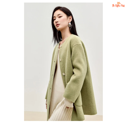 Women’s 100% wool double-sided winter coat in light pistachio and off-white tones, featuring an O-neck, single-breasted closure, pockets, and scarf detail.