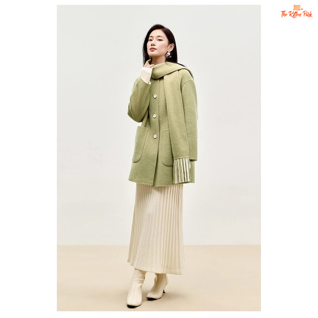 Women’s 100% wool double-sided winter coat in light pistachio and off-white tones, featuring an O-neck, single-breasted closure, pockets, and scarf detail.
