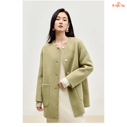 Women’s 100% wool double-sided winter coat in light pistachio and off-white tones, featuring an O-neck, single-breasted closure, pockets, and scarf detail.