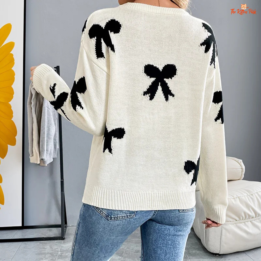 Women’s Bow Jacquard Knit Sweater – Autumn Winter 2026, a loose-fit acrylic pullover with bow jacquard decoration, O-neck and full-length sleeves, ideal for autumn and winter layering.