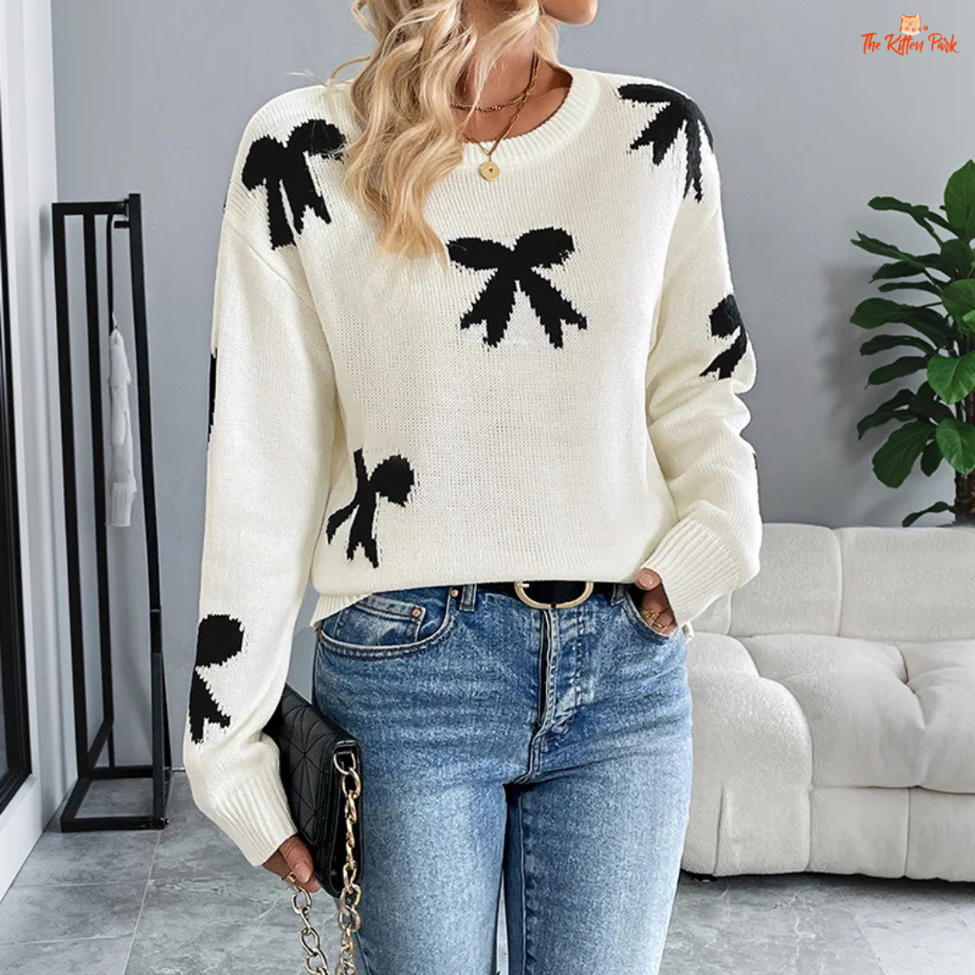 Women’s Bow Jacquard Knit Sweater – Autumn Winter 2026, a loose-fit acrylic pullover with bow jacquard decoration, O-neck and full-length sleeves, ideal for autumn and winter layering.