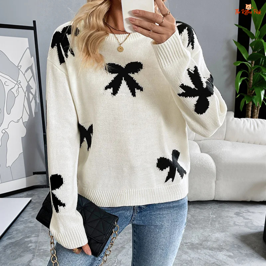 Women’s Bow Jacquard Knit Sweater – Autumn Winter 2026, a loose-fit acrylic pullover with bow jacquard decoration, O-neck and full-length sleeves, ideal for autumn and winter layering.