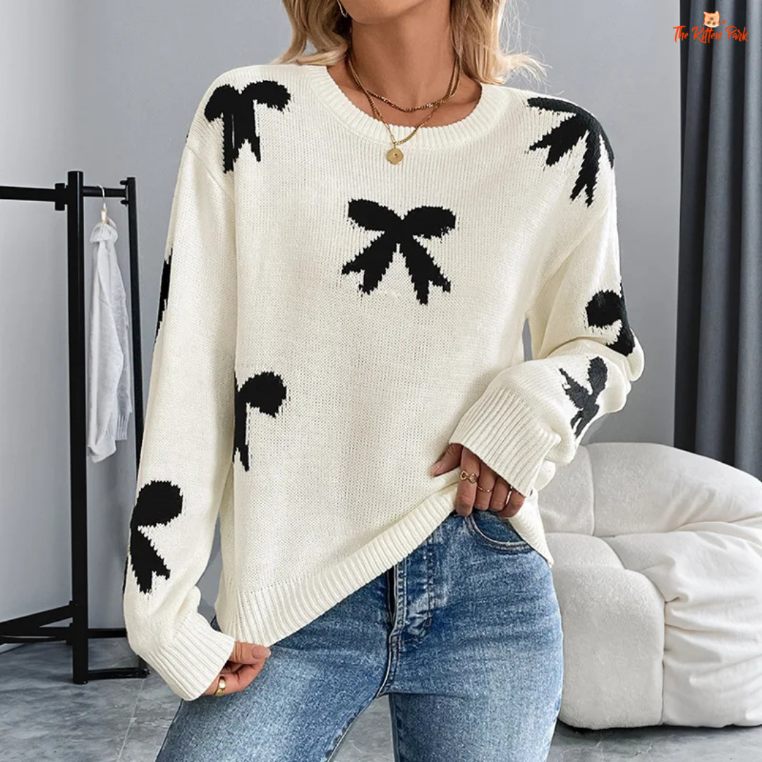 Women’s Bow Jacquard Knit Sweater – Autumn Winter 2026, a loose-fit acrylic pullover with bow jacquard decoration, O-neck and full-length sleeves, ideal for autumn and winter layering.