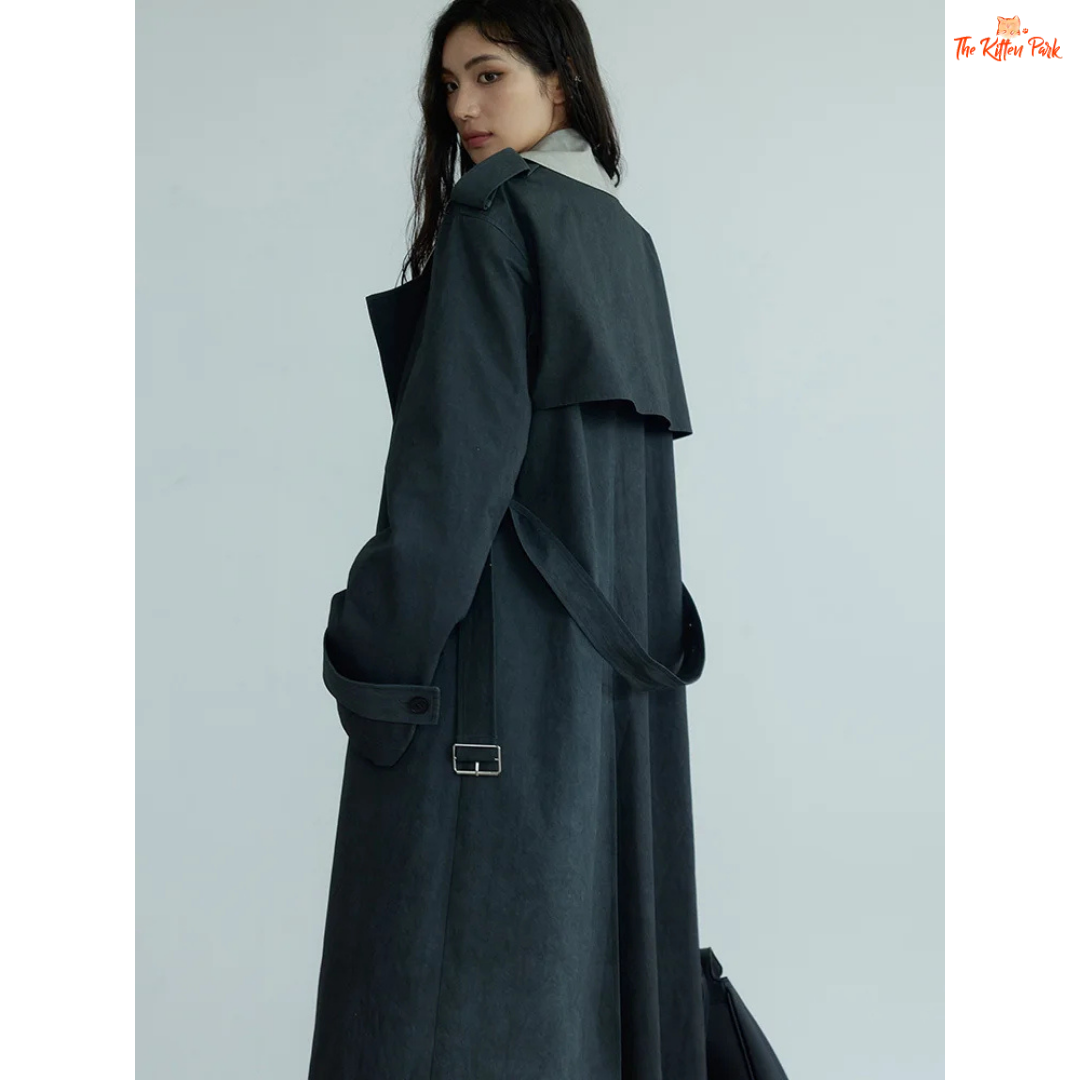 Women’s Gray Color-Block Trench Coat 2026 with slim fit, pockets, turn-down collar, and long windbreaker design in light gray style.