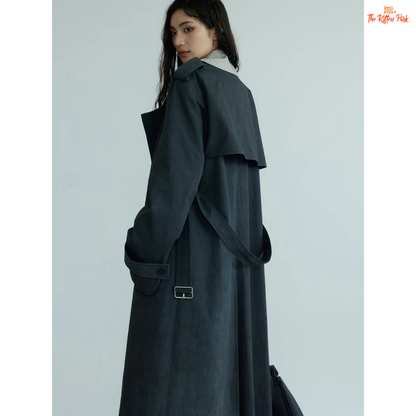 Women’s Gray Color-Block Trench Coat 2026 with slim fit, pockets, turn-down collar, and long windbreaker design in light gray style.