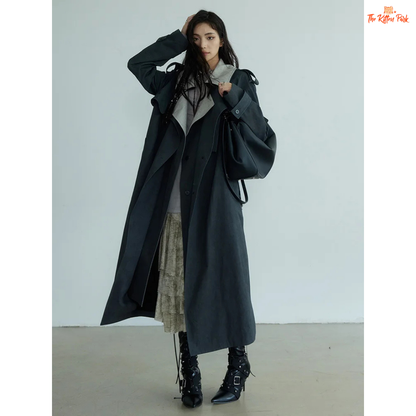 Women’s Gray Color-Block Trench Coat 2026 with slim fit, pockets, turn-down collar, and long windbreaker design in light gray style.