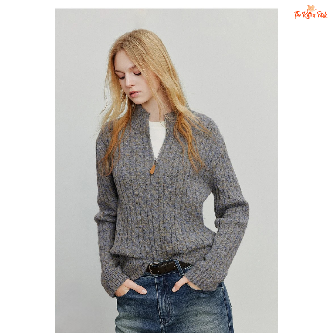 Women's knitted solid pullover with high zipper collar, full sleeves, and regular fit, suitable for autumn and winter office or casual wear.