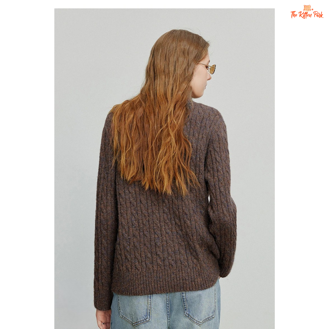 Women's knitted solid pullover with high zipper collar, full sleeves, and regular fit, suitable for autumn and winter office or casual wear.