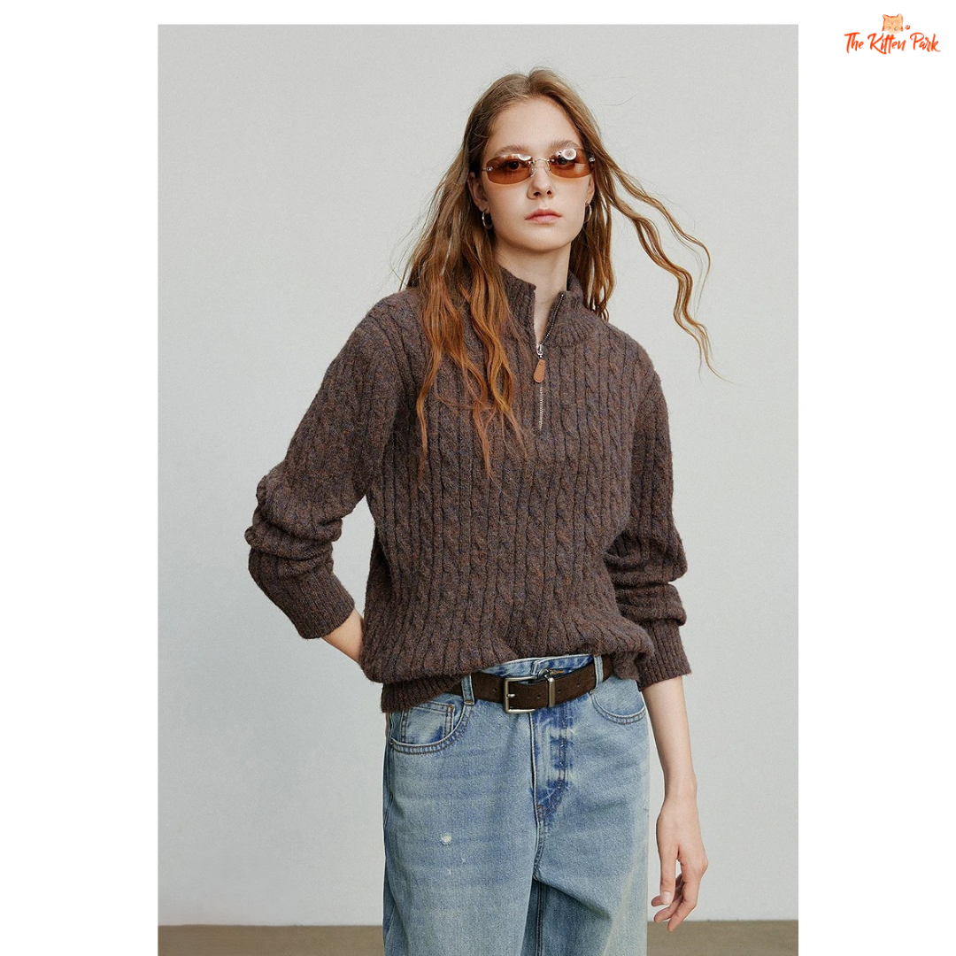 Women's knitted solid pullover with high zipper collar, full sleeves, and regular fit, suitable for autumn and winter office or casual wear.