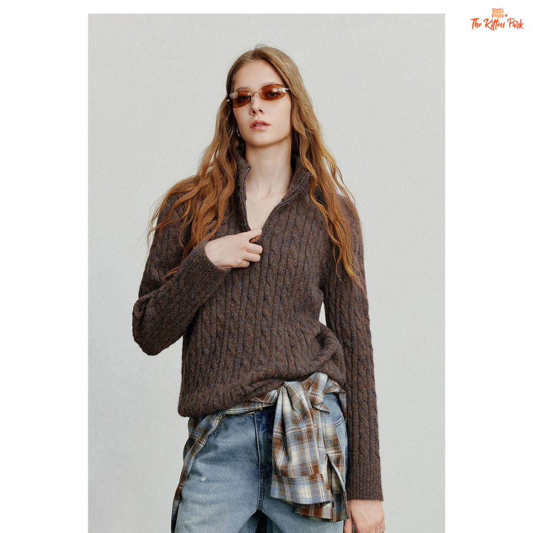 Women's knitted solid pullover with high zipper collar, full sleeves, and regular fit, suitable for autumn and winter office or casual wear.
