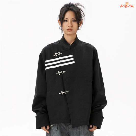 Person wearing a black jacket with white stripes and buckles on a white background