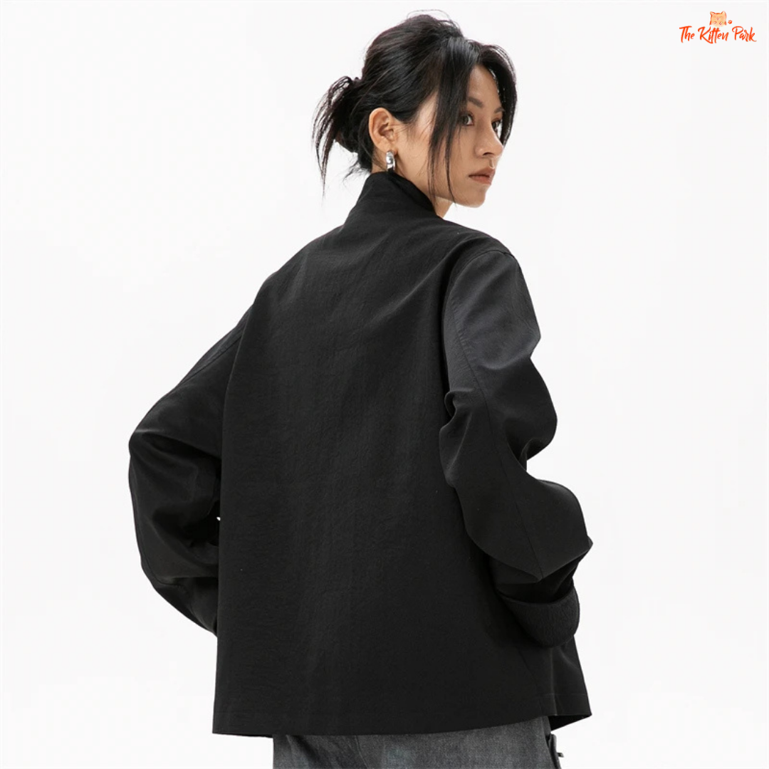 Person wearing a black coat on a white background