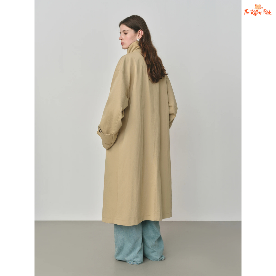 Women’s Oversized Casual Trench Coat 2026 with long length, lace-up decoration, turndown collar, and wide-waisted fit in pink-beige gradient style.